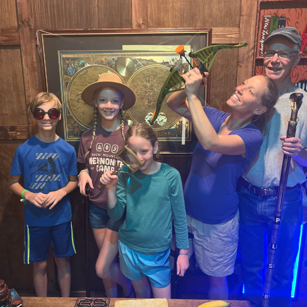 Family enjoying a puzzle-solving adventure at EDGE Escape Room in Winter Garden, a top destination for family fun in Central Florida