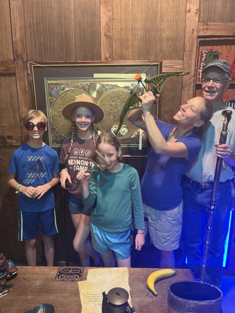 Adventure seekers solving the 'Jewel Thief' puzzle at EDGE Escape Room, a must-visit escape room in Winter Garden for thrill-seekers